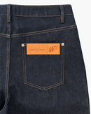 PLEATED RAW DENIM JEANS